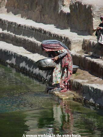 A woman washing in the water basin
